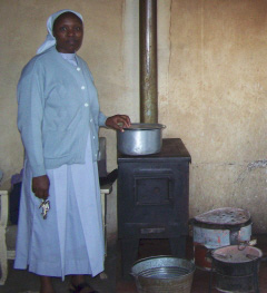 Sister Mary showing the stove that she uses to feed the children